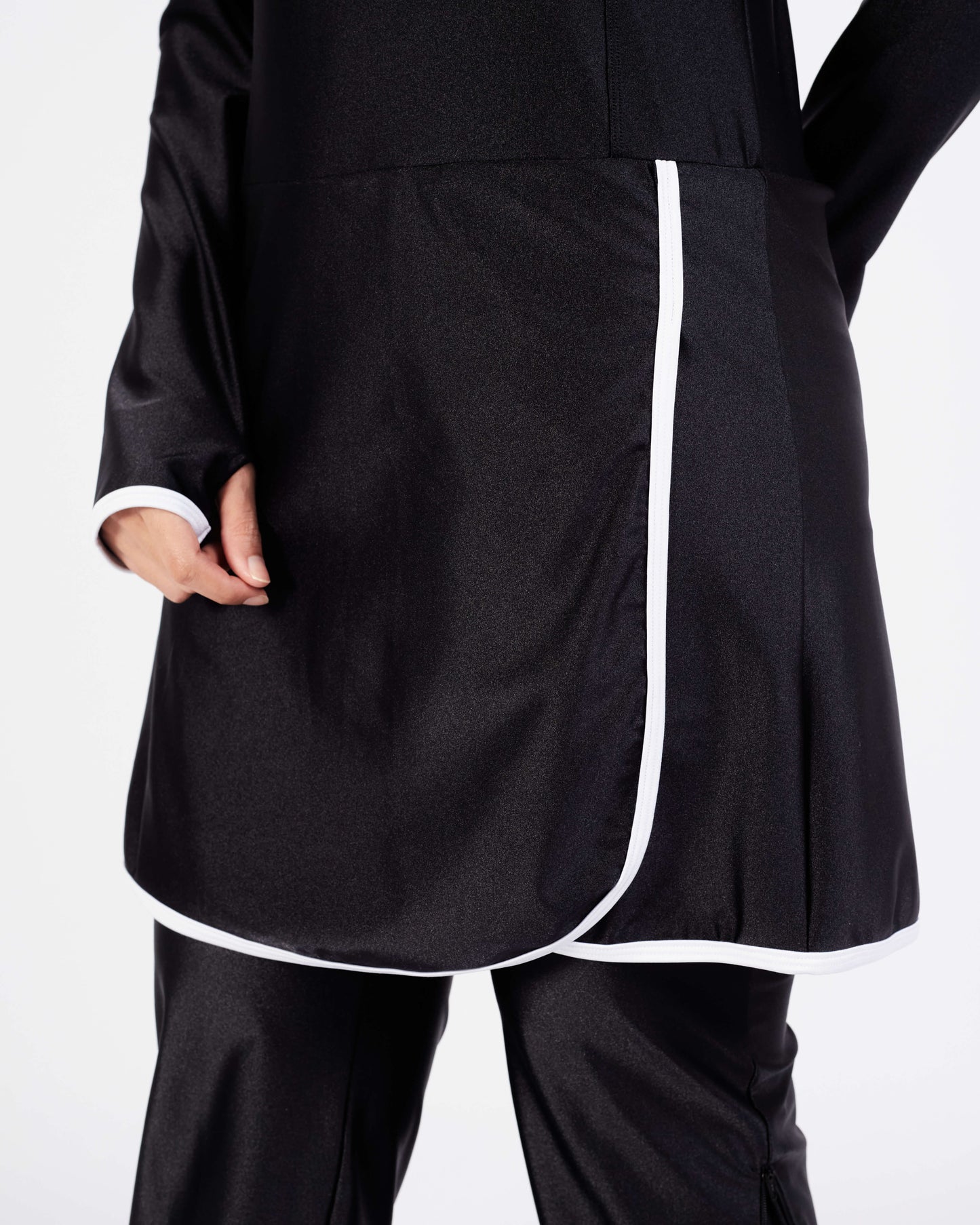 White trim at the edge of dress